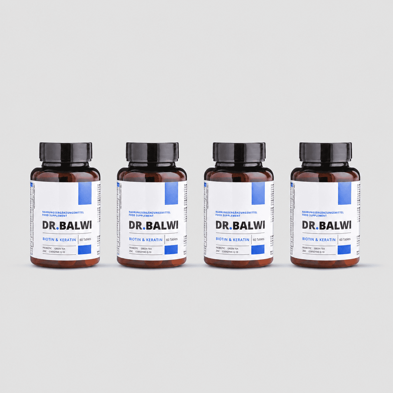 Vier braune Flaschen Dr. Balwi Shop Biotin & Keratin Tabletten zur Unterstützung des Haarwachstums mit weißen und blauen Etiketten stehen nebeneinander vor einem schlichten hellgrauen Hintergrund.